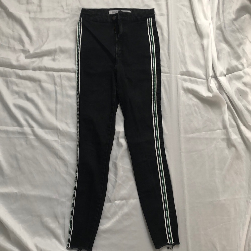 black jeggings with white and green stripes